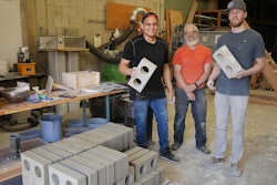 Washington State University team Jose Becerra, David Drake and Jacob Sauer (left to right) display brick they have made from drywall construction waste.