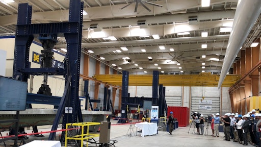 Engineers, Maine Department of Transportation officials, business leaders, investors, researchers, and University of Maine staff watched a stackable, composite girder with precast concrete deck panels exceed twice the collapse strength of steel and concrete girders.