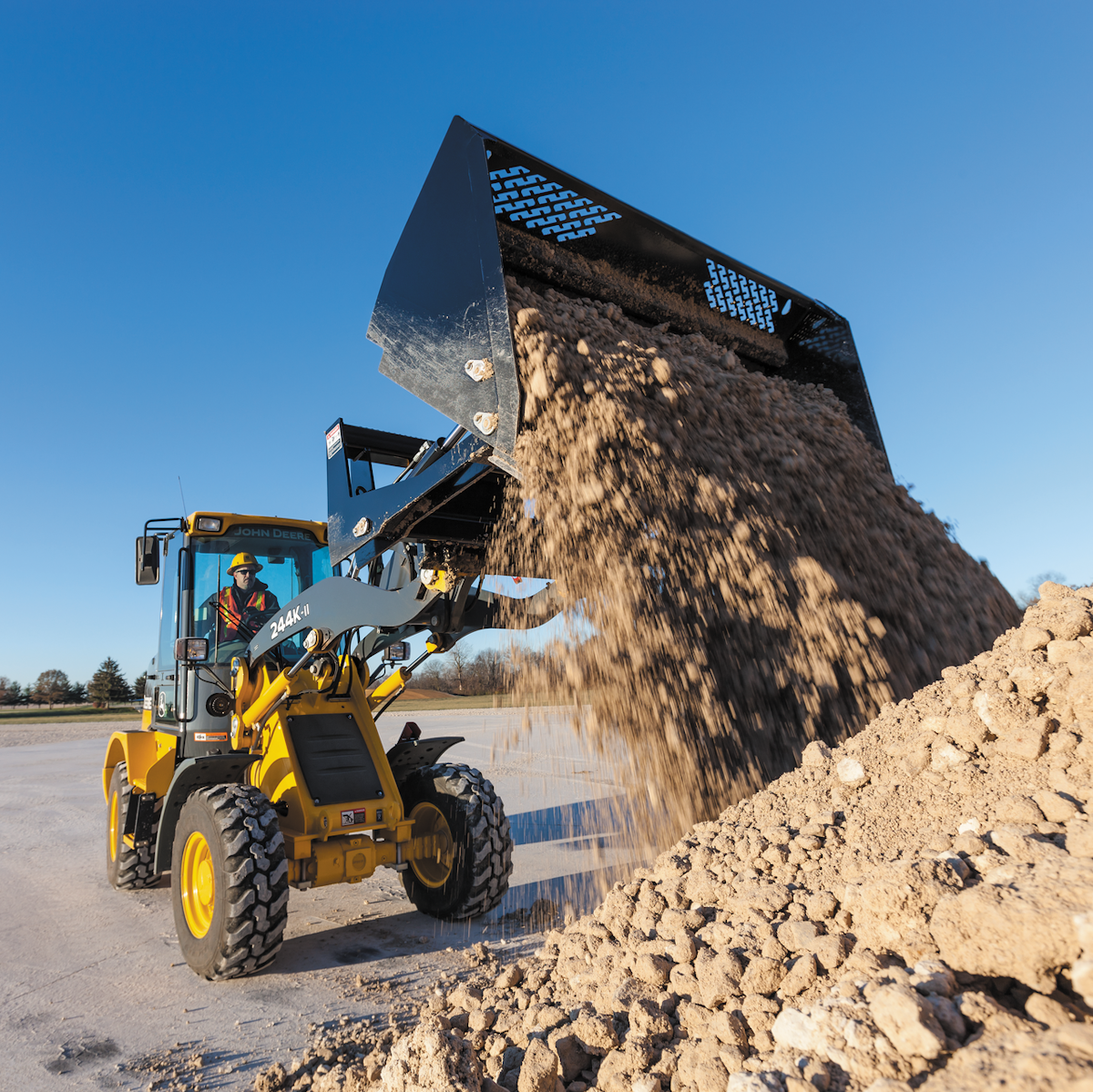 John Deere Rollout Buckets Extend Dump Reach on Compact Track & Wheel