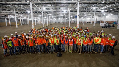 Tradesmen from Barton Malow, Lloyd Concrete Services, Unlimited Concrete Solutions and partners pose prior to embarking on the epic Mega Slab project.
