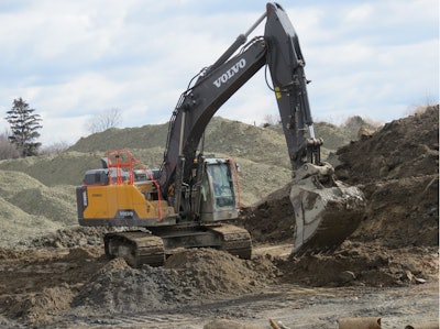 An EC480E prepares to dig surgically.