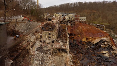 Neuber Demolition & Environmental Services had to set up differently for its demolition project because it had to be cautious to prevent any of the damaged structure from falling into the river below.