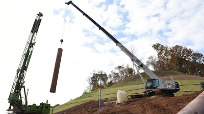 One stretch of the new road requires retaining walls be 65 ft. tall. In order to handle the steep and narrow access roads at the top of the hillside, Blalock & Sons purchased a 50-ton TCC-500 telescopic crawler crane.