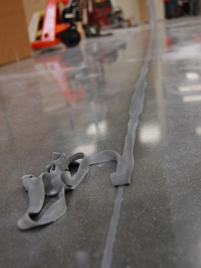 Once filled, the filler is often shaved for an even fill. Pictured here is a polyurea joint filler.