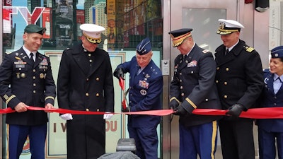 Cutting the ribbon to open the Times Square recruiting station.
