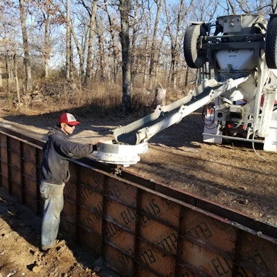 Contractors have better control of placing material in foundation forms when using The Tailgater chute attachment.