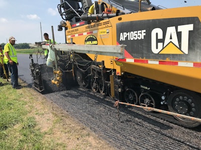 Rubber asphalt overlay construction.