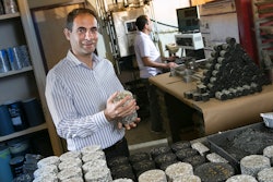 Elie Hajj, associate professor in the Civil and Environmental Engineering Department, shows asphalt core samples being tested in one of five Pavement Engineering and Science Program laboratories.
