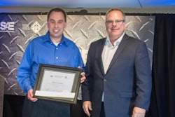 SAE/AEM Outstanding Young Engineer award winner Stephen Lanahan (left) pictured with SAE Board of Directors Commercial Vehicle Vice President Landon Sproull of PACCAR Inc. at 2018 ceremonies.