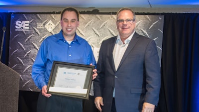 SAE/AEM Outstanding Young Engineer award winner Stephen Lanahan (left) pictured with SAE Board of Directors Commercial Vehicle Vice President Landon Sproull of PACCAR Inc. at 2018 ceremonies.