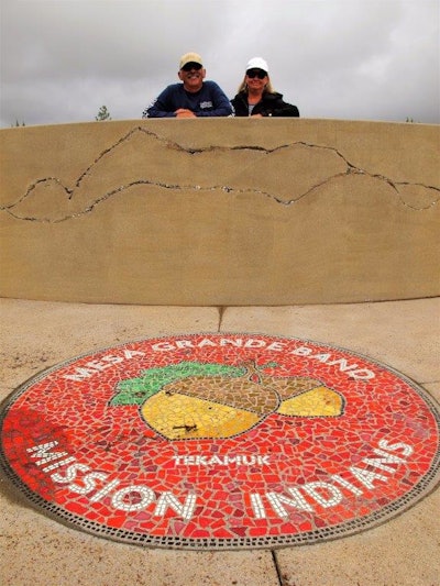 Boulders, tribal mosaics, a stencil of the school mascot and resurfaced athletic courts were installed by volunteers as part of the $250,000 landscape rehab. Pictured is Byron and Chris Klemaske, both with T.B. Penick & Sons, San Diego.