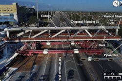 Photograph of 174-ft.-long main span on March 10, 2018, prior to placement on south pier and north pylon pier, looking west. Labels showing diagonal member 11 and vertical member 12 added by NTSB.