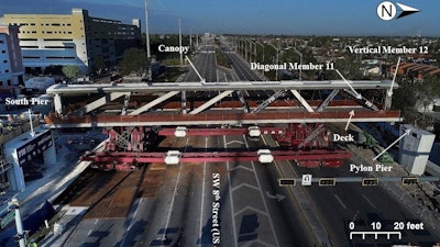 Photograph of 174-ft.-long main span on March 10, 2018, prior to placement on south pier and north pylon pier, looking west. Labels showing diagonal member 11 and vertical member 12 added by NTSB.