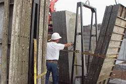 A crane delivers forms to the jobsite.
