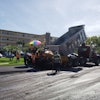 Approximately 18 crew members were directly involved in the project, including ten on the paving crew, five on the milling crew, and four doing the striping.
