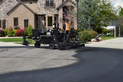 Before any drop of sealcoat makes contact with the surface, it’s imperative to prepare the asphalt; that means dry and clean. Clean off stuck mud with a wire bristle brush and use a high-powered blower to remove debris and water.