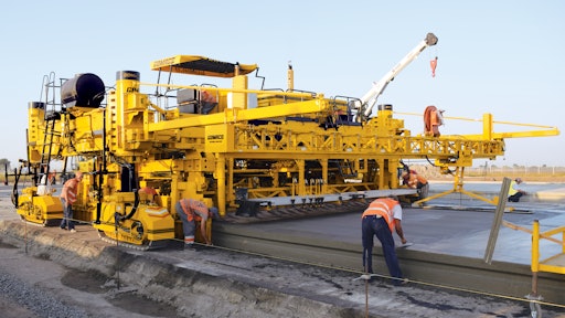 A GOMACO GP4 slipform paver is at work on the Odessa International Airport in Odessa, Ukraine.
