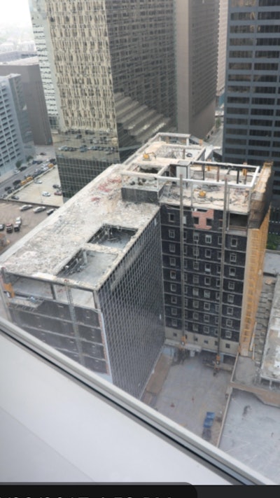 The 10-story concrete Americana Tower and penthouse structure sat atop a six-story parking structure located on Dallas Street in Houston.