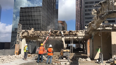 Grant Mackay worked with its structural engineer to remove mechanical equipment then metal structural components of the penthouse using Brokk robots and oxy/propane cutting equipment.