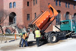 The Public Works Department team using its Falcon hot box and recycler to make repairs outside New Trier High School in Winnetka, IL. Built to be slid into the bed of a truck, the Falcon unit is available in 2-, 3-, 4-, 5-, 6-, 8- or 10-ton capacities.