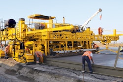 A GOMACO GP4 slipform paver is at work on the Odessa International Airport in Odessa, Ukraine.