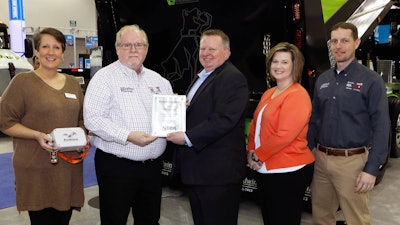 Accepting the award for The Godwin Group from NTEA President & CEO Steve Carey (center) are, from left to right: Phyllis Godwin Norris, Corp. Vice President and VP of Sales; Pat Godwin (Jr.), Corp. President, R&D/Gov. Contract; Kristie Stockman, National Sales Manager; and Patrick Godwin III, CMO.