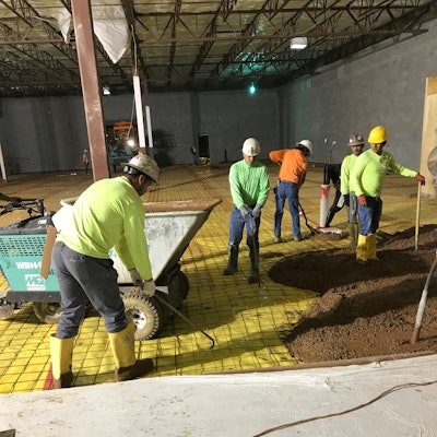 Mesh being pulled during concrete placement.