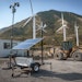 At this remote construction site in Utah, the sun, wind and a battery bank join forces to power security cameras.