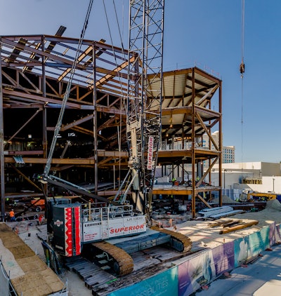 Superior Rigging and Erecting Co. used its Liebherr LR 1300 SX crawler crane to hoist the large 65,000-lb. steel trusses that were used to build the new structure.