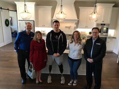 In the kitchen of the Murphys’ new smart home (pictured left to right): MAPEI Business Development Leader Dale Penland, MAPEI Marketing Communications Manager Jennifer Kramer, United States Army Captain (Ret.) Jake Murphy, Jake’s wife Lisa Murphy and MAPEI Central Area Sales Director Kyle Murphy