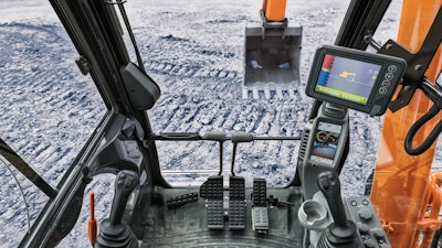Real-time grade indicator allows operators to manage grade without leaving the cab, and reduces need for grade checkers or grade stakes. Controls integrated into the joysticks enables fingertip control.