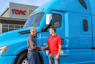 Daimler Trucks North America CEO, Roger Nielsen (left), shakes hands with Torc CEO, Michael Fleming.