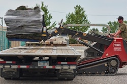 Loader arms on the new Toro Dingo TXL 2000 telescope out to 44 in. of reach for unloading a flat-bed truck from one side.
