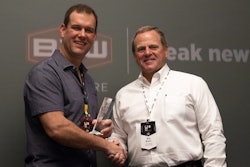 Bob Brown, right, president of B2W Software presents the B2W Software 2019 Client Innovation Award for Best Use of the B2W ONE Platform to Ryan Priestly, president of Priestly Demolition.