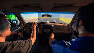 Students use a driving simulator on the Missouri S&T campus to test the Route 160 roadway design before construction.