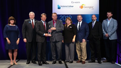 From left: Amy Carter, Deputy Commissioner for Rural Georgia Initiative with Georgia Department of Economic Development; Technical College System of Georgia Commissioner Matt Arthur, Georgia Gov. Brian Kemp, James Suchovsky, Statesboro plant manager of Briggs & Stratton, Amanda See, human relations manager, and other Briggs & Stratton employees.