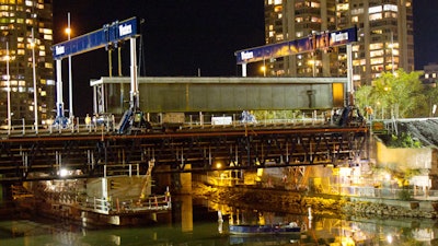 To prevent overloading the partly deconstructed, 100-year-old bridge, Western Mechanical laid gantry track system independent of the bridge itself, requiring a 79-ft.-long header beam.