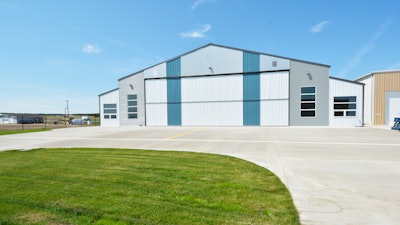 On both sides of the Acheson hangar is an office and a lounge. Within is a Cirrus II simulator room that Gary Acheson and his two son-in-law pilots use to keep them safe.