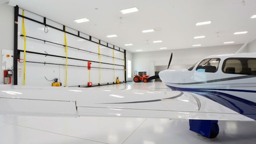 The hangar has a Schweiss Doors 55' x 19.5' liftstrap/autolatch door. Five strong liftstraps open the door. When fully open there is plenty of headroom and the door provides a shaded canopy.