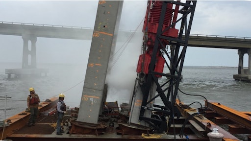 Workers install piles for the new Basnight bridge in North Carolina.