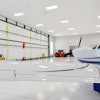 The hangar has a Schweiss Doors 55' x 19.5' liftstrap/autolatch door. Five strong liftstraps open the door. When fully open there is plenty of headroom and the door provides a shaded canopy.