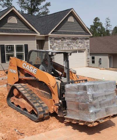 Precision Landscaping uses a Case TR310 to move block pallets and other materials on residential sites.