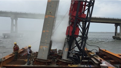 Workers install piles for the new Basnight bridge in North Carolina.