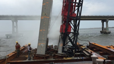 Workers install piles for the new Basnight bridge in North Carolina.