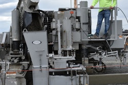 Owner Travis Knox places a section of curb. Only himself and another crew member are trained to operate the curb and gutter machine.