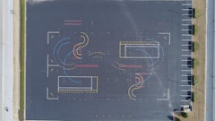 Layout of the training area started with marking the four corners of the 30,000-sq.-ft. area, creating the outlines of a rectangle. Bolts were screwed into the pavement at the four spots, and the four points were connected by a nylon baling cable, creating the outlines of a rectangle. This long sides of the rectangle served as reference points to help position markings within the test track.