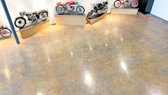 Layers of paint, epoxy, carpeting, luxury vinyl tile and vinyl composite tile once covered the floor at the Moto Museum in St. Louis, which houses some of the rarest motorcycles in the existence.