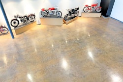 Layers of paint, epoxy, carpeting, luxury vinyl tile and vinyl composite tile once covered the floor at the Moto Museum in St. Louis, which houses some of the rarest motorcycles in the existence.