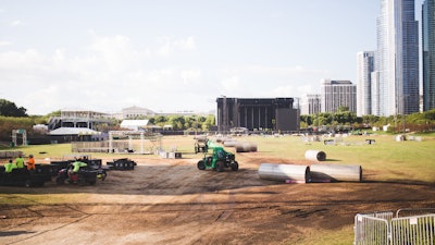 Sunbelt Rentals is usually one of the first teams on the site because Lollapalooza can’t start building until the ground protection is in place.
