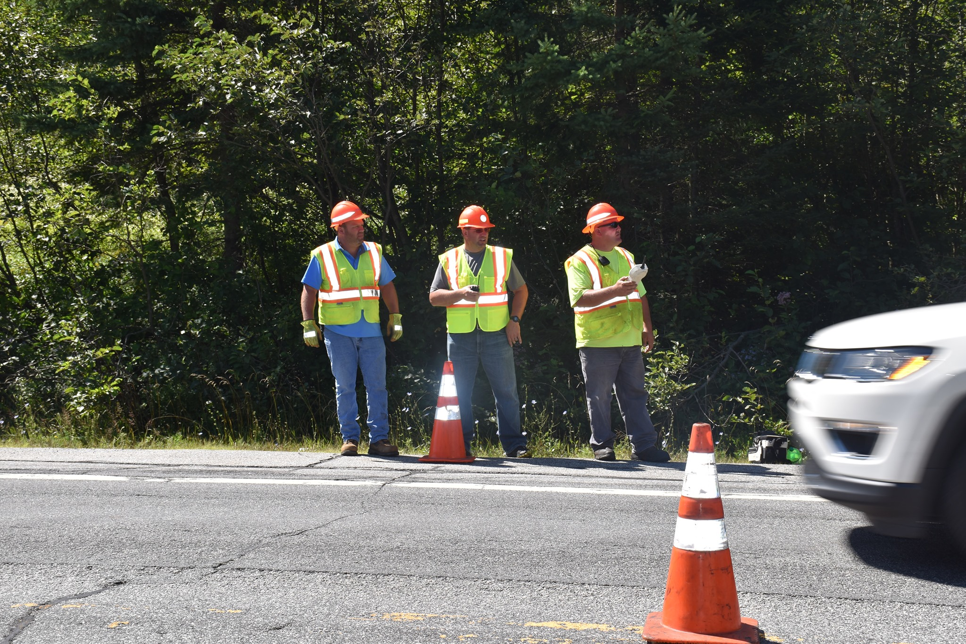 One of these construction workers is a New York State police officer who is working to keep work zones safer.